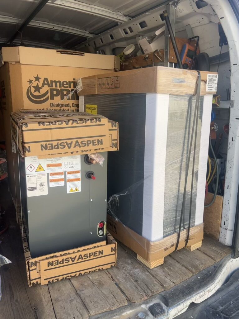 Stacked appliance boxes in a storage area.