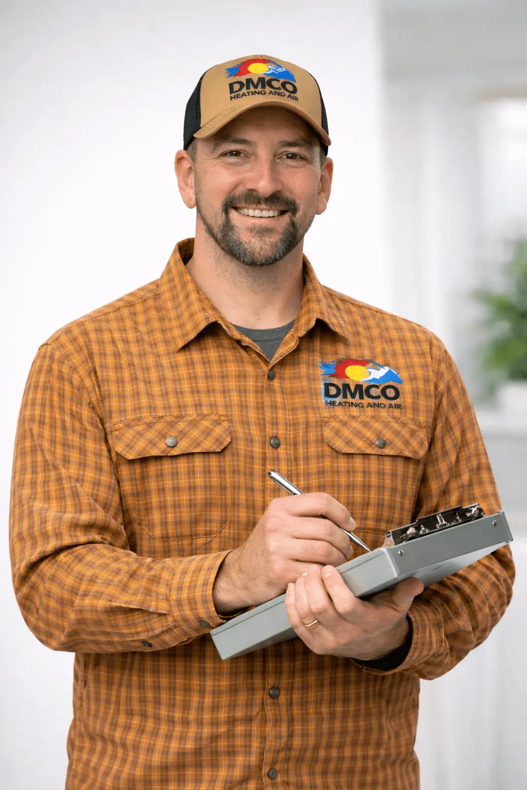 Smiling technician in DMCO uniform with clipboard